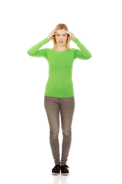 Angry woman holding her head. — Stock Photo, Image