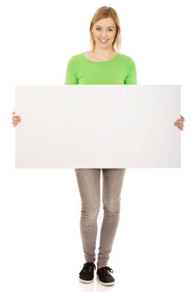 Happy woman with blank board.