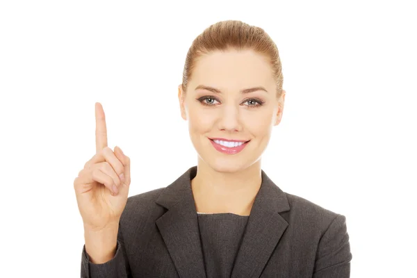 Mujer de negocios señalando hacia arriba . —  Fotos de Stock