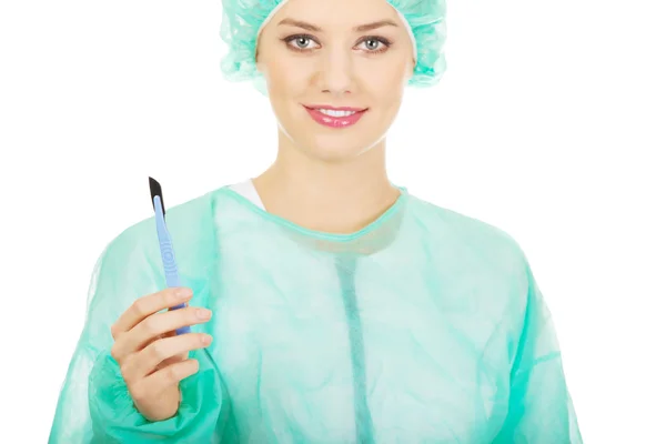 Female surgeon doctor with a scalpel. — Stock Photo, Image