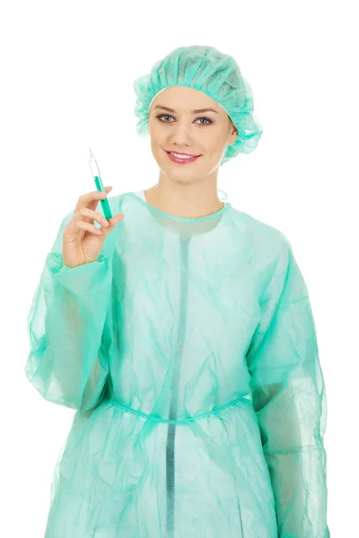 Female doctor holding a syringe. — Stock Photo, Image