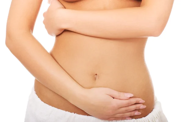 Woman cares about her belly. — Stock Photo, Image