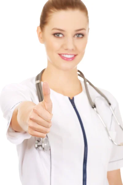 Medicine doktor kvinna med tummen upp. Royaltyfria Stockbilder