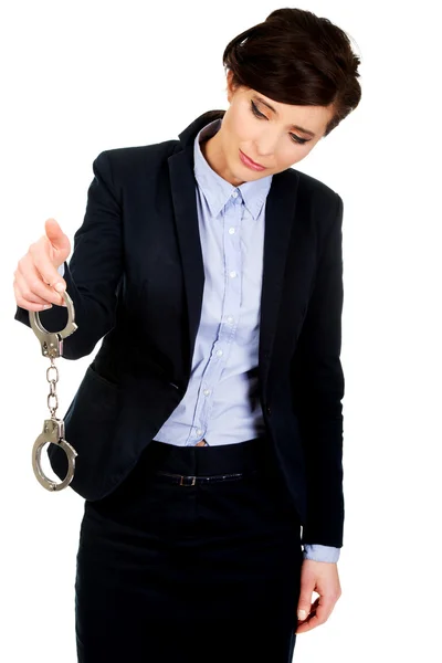 Businesswoman holding metal handcuffs. — Stock Photo, Image