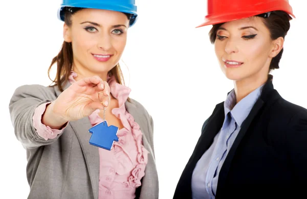 Two architects women with house key. — Stock Photo, Image