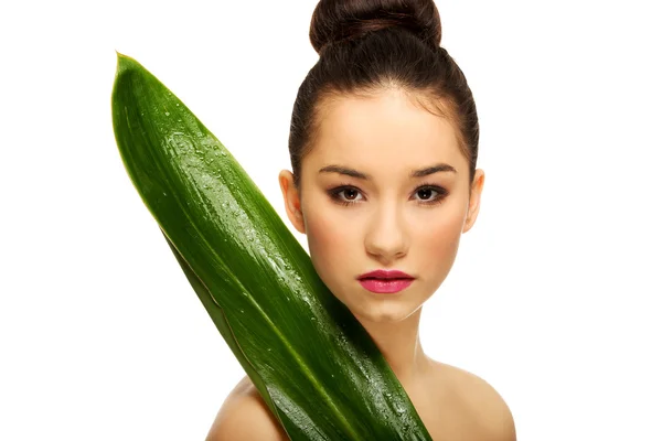 Beautiful woman with green leaf. — Stock Photo, Image