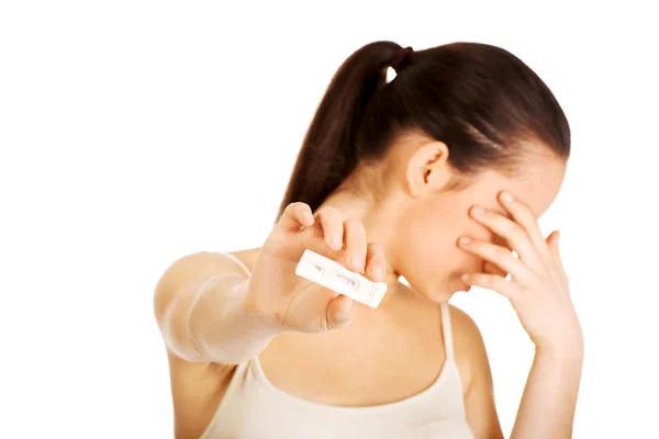 Depressed woman with pregnancy test. — Stock Photo, Image