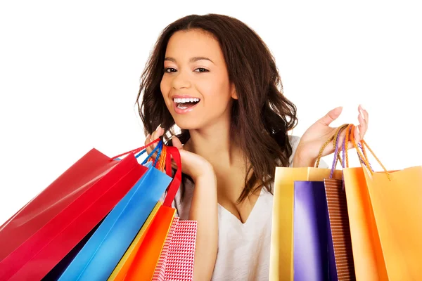 Feliz mulher sorridente com sacos de compras . — Fotografia de Stock