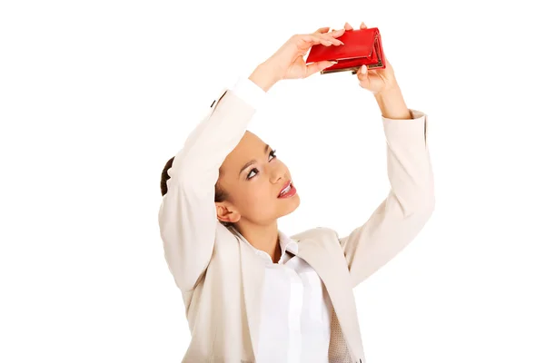 Businesswoman shaking a wallet. — Stock Photo, Image