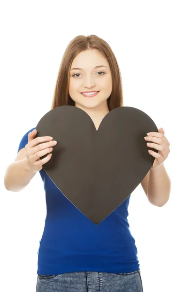 Happy teenager holding paper heart. — Stock Photo, Image