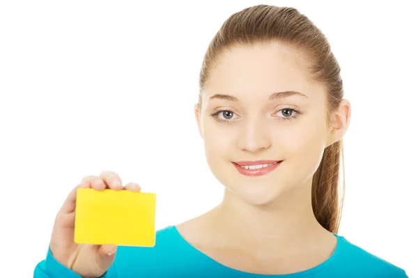 Young woman holding paper card. — Stock Photo, Image