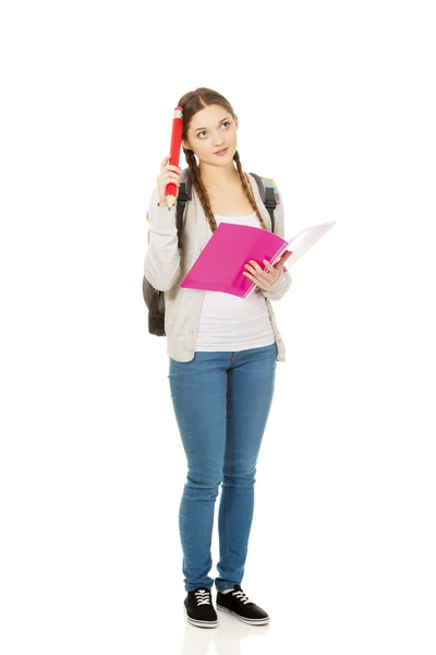 Thoughtful student woman with big pencil. — Stock Photo, Image