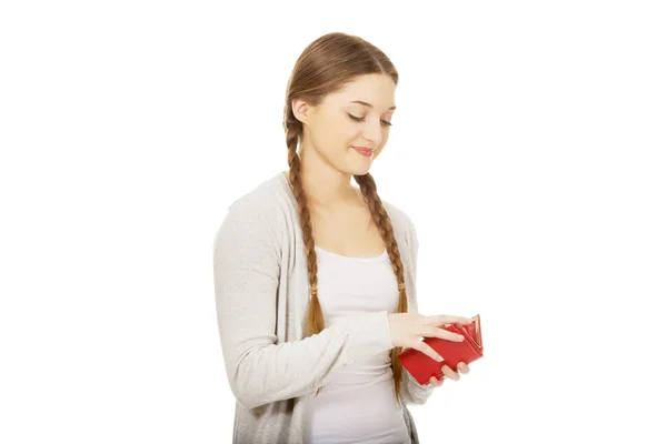 Happy teen woman with a wallet. — Stock Photo, Image