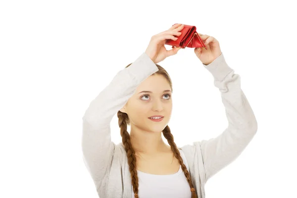 Joven mujer infeliz con el bolso vacío . — Foto de Stock