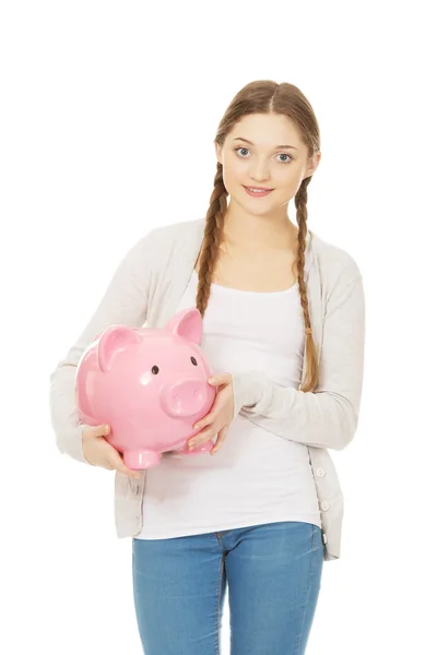 Teenage woman holding piggybank. — Stock Photo, Image