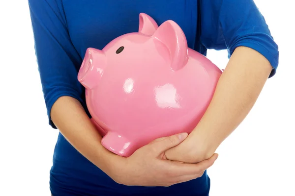 Kvinna anläggning piggybank. — Stockfoto