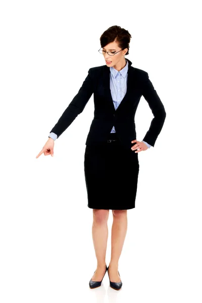 Businesswoman pointing down. — Stock Photo, Image