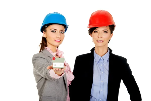 Two architects women with house model. — Stock Photo, Image