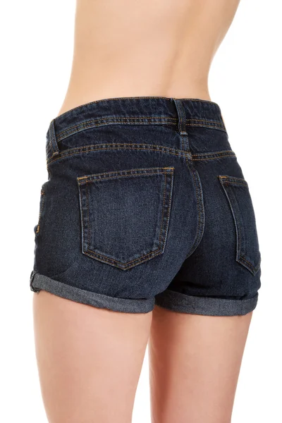 Shirtless woman in jeans shorts. — Stock Photo, Image