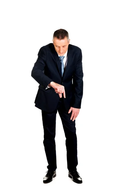 Full length businessman showing small size — Stock Photo, Image