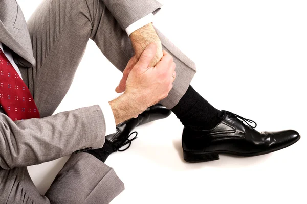 Close up businessman sitting on the floor — Stock Photo, Image