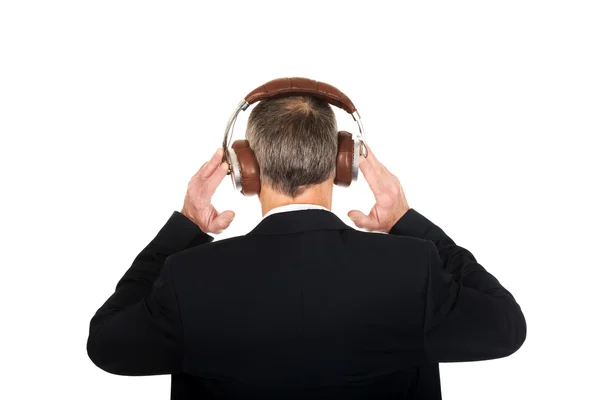 Businessman with big headphones Stock Photo