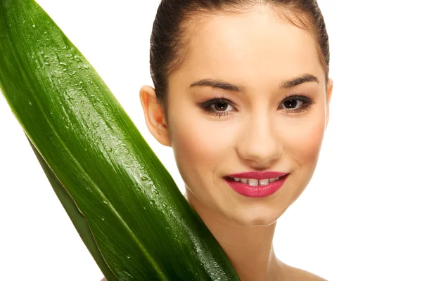 Beautiful woman with green leaf. — Stock Photo, Image