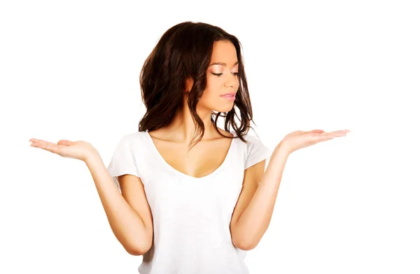 Woman holding something on palms. — Stock Photo, Image