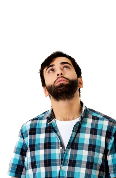 Jovem homem bonito olhando para cima . — Fotografia de Stock