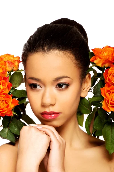 Beauty african woman with roses. — Stock Photo, Image