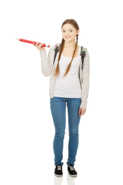 Bir kenara kalemle işaret kız öğrenci. — Stok fotoğraf