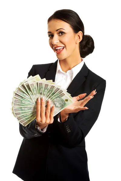 Businesswoman holding a clip of polish money — Stock Photo, Image