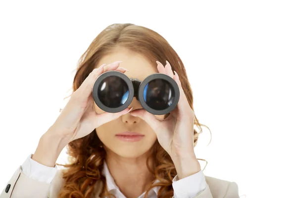 Businesswoman looking through binoculars. — Stock Photo, Image