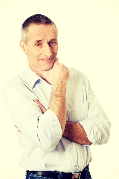 Portrait of a good looking man touching chin — Stock Photo, Image