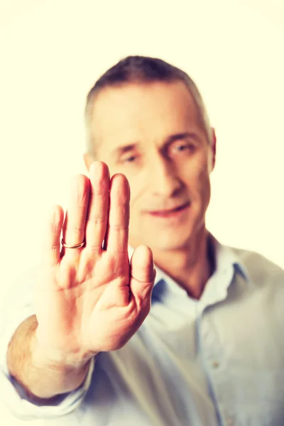 Mature man making stop sign — Stock Photo, Image