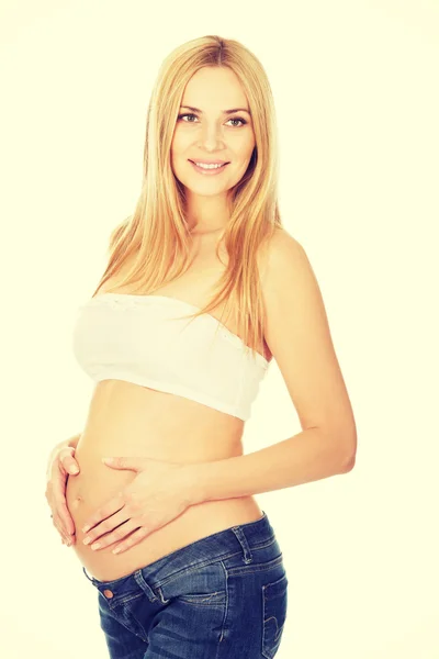 Happy pregnant woman looking at camera — Stock Photo, Image