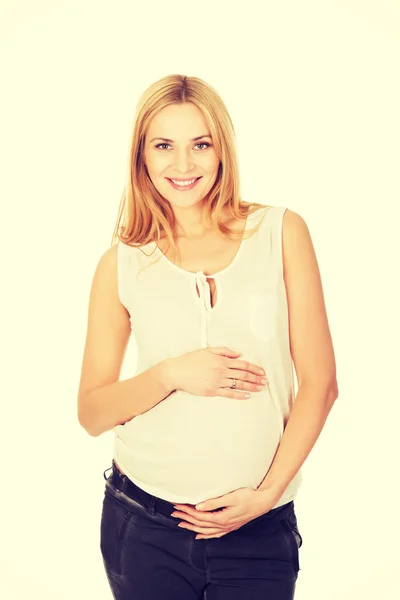 Happy pregnant woman looking at camera — Stock Photo, Image