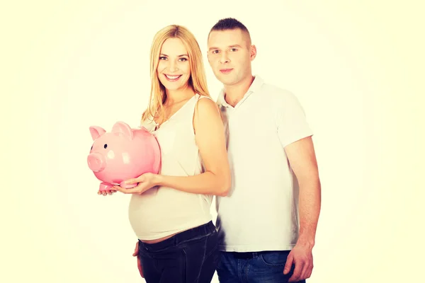 Bonito jovem casal com banco porquinho — Fotografia de Stock