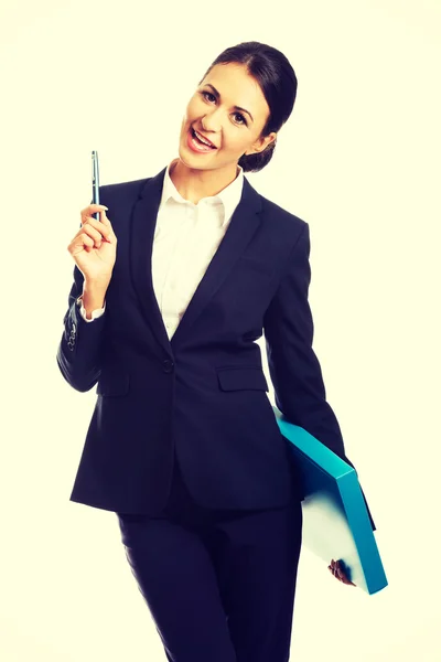 Happy businesswoman holding a pen — Stock Photo, Image