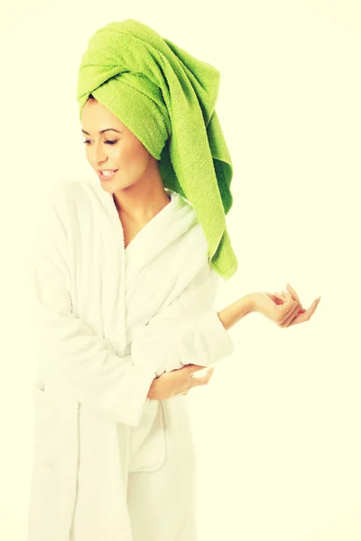 Woman in bathrobe looking down — Stock Photo, Image