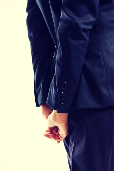 Close up on businesswoman clenching hands behind her back — Stock Photo, Image