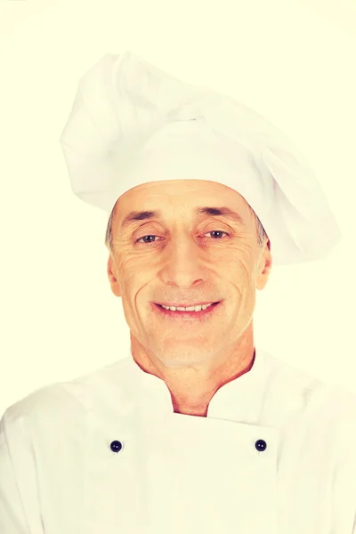 Professionele chef-kok in het witte uniform en hoed — Stockfoto