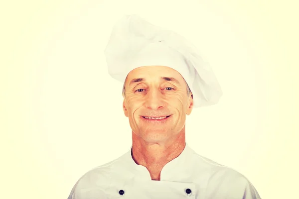 Професійний шеф-кухар у білій формі та капелюсі — стокове фото