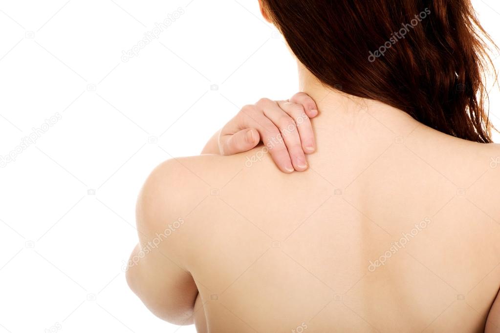 Woman holding her back.