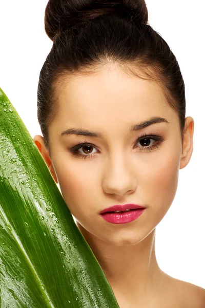 Beautiful woman with green leaf. — Stock Photo, Image