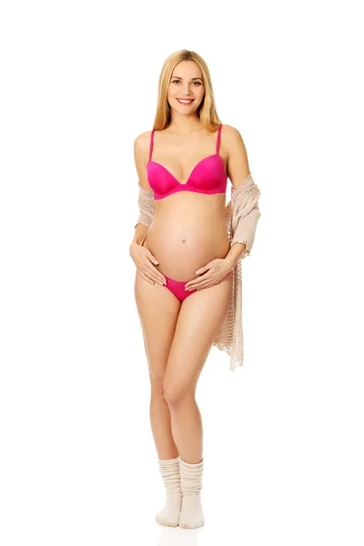 Mulher grávida em lingerie e meias — Fotografia de Stock