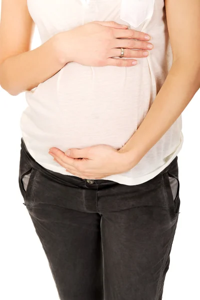 Zwanger vrouw houden haar buik — Stockfoto