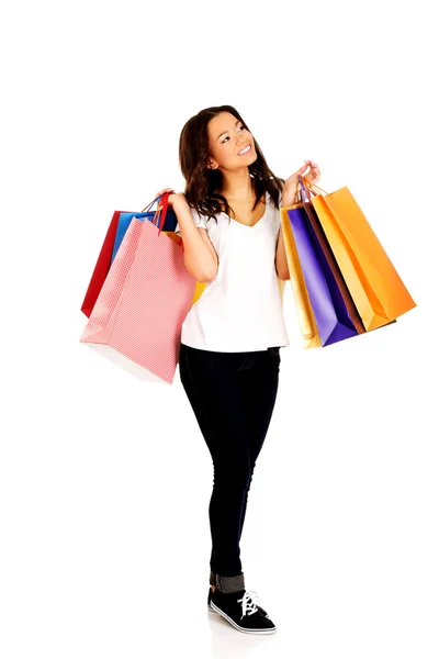 Feliz mulher sorridente com sacos de compras . — Fotografia de Stock