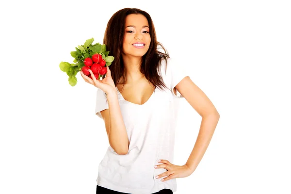 Young woman with bunch of radishes. — Stock Photo, Image