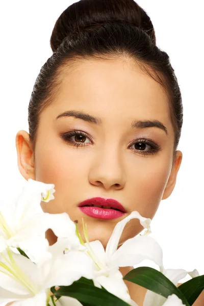 Schönheit Gesicht einer Frau mit Blume. lizenzfreie Stockbilder